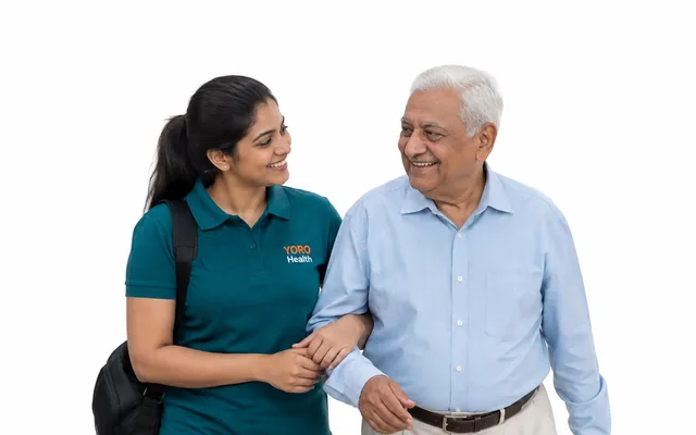 A care assistant with an older woman in a wheelchair